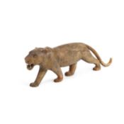 A 19TH CENTURY MIDDLE EASTERN CARVED RHINOCEROS HORN MODEL OF A LION