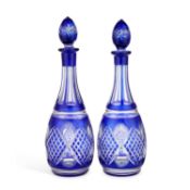 A PAIR OF BOHEMIAN BLUE FLASH GLASS DECANTERS AND STOPPERS