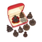 A COLLECTION OF SECOND WORLD WAR ECONOMY PLASTIC CAP BADGES