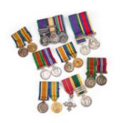 A COLLECTION OF MOUNTED MINIATURE MEDAL GROUPS