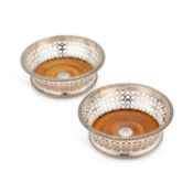A PAIR OF VICTORIAN SILVER-PLATED WINE COASTERS