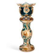 A 19TH CENTURY CONTINENTAL MAJOLICA JARDINIÈRE ON STAND