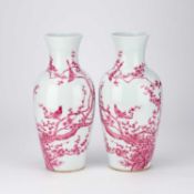 A REFLECTIVE PAIR OF CHINESE PUCE ENAMEL PORCELAIN VASES