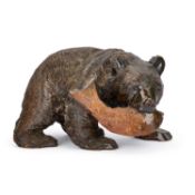 A 20TH CENTURY JAPANESE WOOD CARVING OF A BEAR WITH A FISH