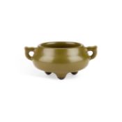 A CHINESE TEA-DUST GLAZED TWO-HANDLED TRIPOD CENSER