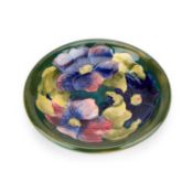 A WALTER MOORCROFT POTTERY PLATE