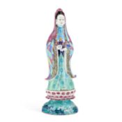 A CHINESE FAMILLE ROSE PORCELAIN FIGURE OF GUANYIN ON STAND, CIRCA 1700