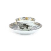 A CHINESE EN GRISAILLE TEA BOWL AND SAUCER