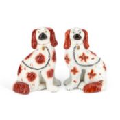 A PAIR OF VICTORIAN STAFFORDSHIRE POTTERY MODELS OF SPANIELS CIRCA 1860