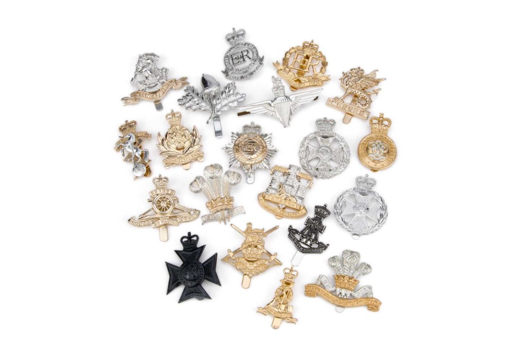 A COLLECTION OF STAYBRITE CAP BADGES
