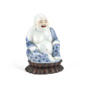 A CHINESE BLUE AND WHITE PORCELAIN FIGURE OF A BUDDHA EARLY 20TH CENTURY