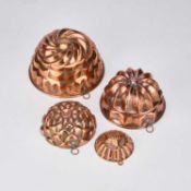 A GROUP OF COPPER JELLY MOULDS