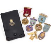 FOUR SILVER-GILT AND ENAMEL MASONIC JEWELS