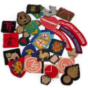A GROUP OF CLOTH DIVISIONAL INSIGNIA, SHOULDER TITLES, FORMATION PATCHES AND RANK BADGES