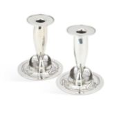 ARCHIBALD KNOX (1864-1933) FOR LIBERTY & CO A PAIR OF TUDRIC PEWTER CANDLESTICKS