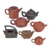 A GROUP OF SEVEN CHINESE YIXING TEAPOTS