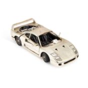 AN ITALIAN SILVER MODEL OF A FERRARI