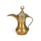 AN ARABIC BRASS DALLAH COFFEE POT