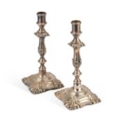 A PAIR OF 19TH CENTURY SILVER-PLATED CANDLESTICKS