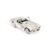 AN ITALIAN SILVER MODEL OF A CAR