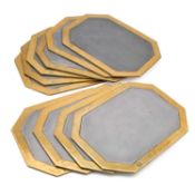 A SET OF TEN DAVID MARSHALL ALUMINIUM AND BRASS LARGE BRUTALIST TABLE MATS