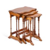 A SET OF THREE BURR WALNUT VENEERED NESTING TABLES