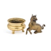 A SMALL CHINESE BRONZE TRIPOD CENSER AND A CHINESE MODEL OF A QILIN