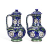 A PAIR OF IZNIK STYLE EWERS AND COVERS LATE 19TH OR EARLY 20TH CENTURY