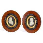 A PAIR OF WEDGWOOD BLACK JASPER PORTRAIT PLAQUES OF JOSIAH WEDGWOOD AND THOMAS BENTLEY LATE 18TH CEN