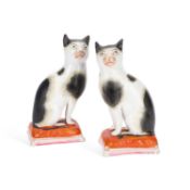 A RARE PAIR OF STAFFORDSHIRE POTTERY MODELS OF CATS CIRCA 1850