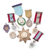 A GROUP OF SILVER MASONIC JEWELS