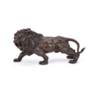 A LATE 20TH CENTURY SCHOOL BRONZE SCULPTURE OF A LION