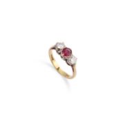 AN 18 CARAT GOLD RUBY AND DIAMOND THREE STONE RING