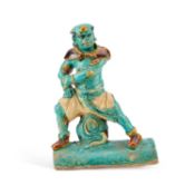 A CHINESE TURQUOISE-GLAZED 'WARRIOR' ROOF TILE, MING DYNASTY