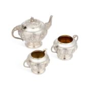 AN EARLY 20TH CENTURY ANGLO-INDIAN SILVER THREE-PIECE TEA SERVICE