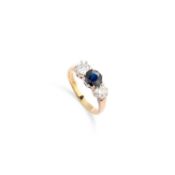 AN 18 CARAT GOLD SAPPHIRE AND DIAMOND THREE STONE RING