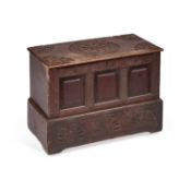 A CARVED OAK COFFER BACH