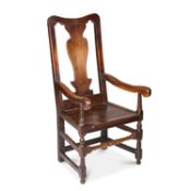 A GEORGE I OAK OPEN ARMCHAIR