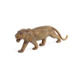 A 19TH CENTURY MIDDLE EASTERN CARVED RHINOCEROS HORN MODEL OF A LION