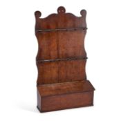 AN EARLY 19TH CENTURY OAK SPOON RACK