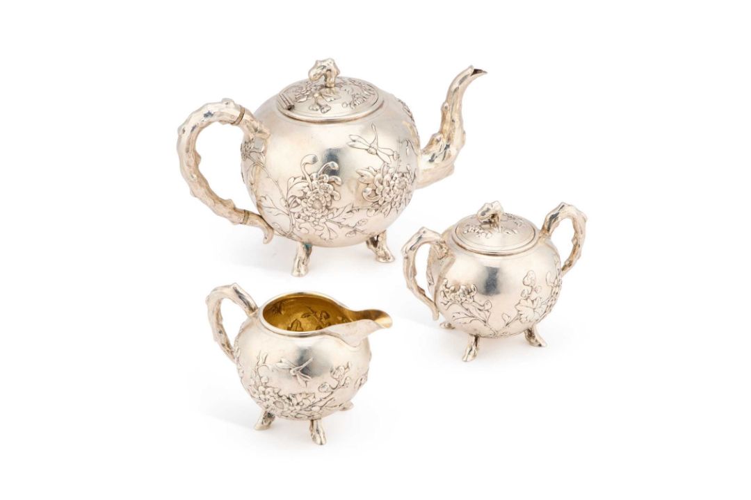 A CHINESE SILVER THREE-PIECE TEA SERVICE - Image 1 of 2