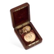 A GOLD PLATED WALTHAM POCKET WATCH WITH A 9CT GOLD ALBERT CHAIN.