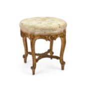 A 19TH CENTURY CARVED GILTWOOD AND UPHOLSTERED STOOL