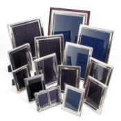 A COLLECTION OF FOURTEEN SILVER-MOUNTED PHOTOGRAPH FRAMES