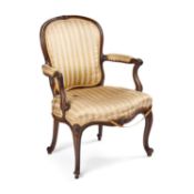 A WALNUT AND UPHOLSTERED FAUTEUIL IN THE FRENCH HEPPLEWHITE STYLE