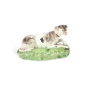 A STAFFORDSHIRE POTTERY MODEL OF A RECUMBENT HOUND ENOCH WOOD, CIRCA 1830