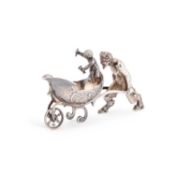 A CONTINENTAL MODEL OF A DEVIL PUSHING A CART