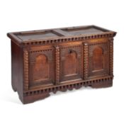 A LARGE CONTINENTAL OAK COFFER 19TH CENTURY OR EARLIER