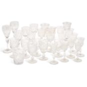 A GROUP OF DRINKING GLASSES AND A DECANTER