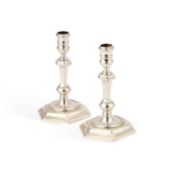 A PAIR OF GEORGE I CAST SILVER CANDLESTICKS